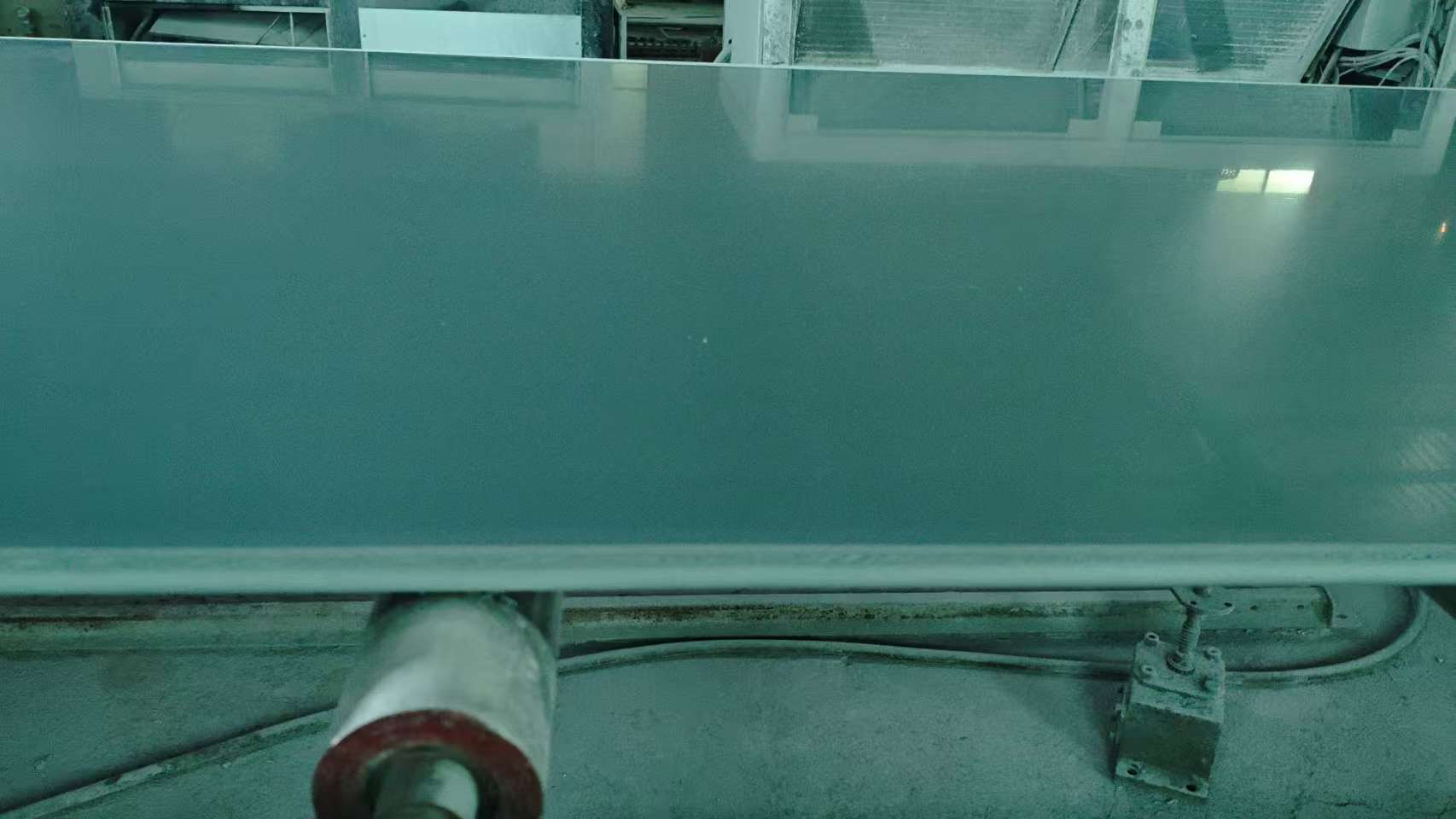 Construction site with blue barriers workers and building materials using PVC formwork